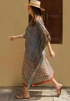 Women's Summer Cotton Short Kaftan, a stylish and comfortable garment perfect for warm weather and resort wear. This kaftan features Indian block print designs, handmade silk Jari border detailing, and a loose kimono-style fit that makes it ideal as a beach cover-up or casual dress.   Crafted from lightweight and breathable cotton fabric, this kaftan ensures comfort and ease of wear, even on the hottest summer days. The soft and natural feel of cotton makes it a perfect choice for lounging by the pool or strolling along the beach. The kaftan is adorned with intricate Indian block print designs, adding a touch of traditional craftsmanship and cultural flair to the garment. Each print is meticulously handcrafted, creating a unique and artisanal look. Enhancing the elegance of the kaftan is t Traditional Summer Kimono With Block Print, Traditional Summer Block Print Kimono, Bohemian Kimono With Block Print, Bohemian Block Print Kimono For Summer, Bohemian Block Print Summer Kimono, Traditional Beige Kimono For Beach, Traditional Beige Kimono For Vacation, Summer Bohemian Kaftan Straight Kurta, Summer Bohemian Straight Kurta Kaftan