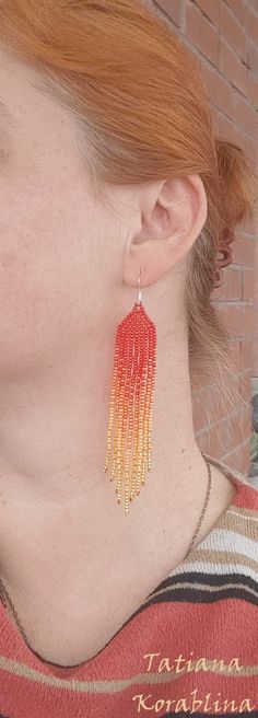 These handmade earrings are made of high-quality Czech beads and strong synthetic thread. They are elegant, fashionable, and highly versatile, suitable for everyday wear. Color: red, orange. There may be some color discrepancies which is due to the different monitor settings 100% hand made with love! Measurements: Length-about 11cm (4.3 inch) Width -about 2 cm (0.79 inch) Materials: Sterling silver components Czech glass beads Strong bead weaving thread Adjustable Red Handwoven Earrings, Handmade Red Tassel Earrings With Round Beads, Red Dangle Beaded Earrings For Summer, Handmade Red Beaded Earrings For Summer, Handwoven Red Earrings, Red Drop Tassel Earrings For Summer, Red Tassel Drop Earrings For Summer, Orange Tassel Earrings With Colorful Beads As Gift, Adjustable Red Beaded Earrings For Summer