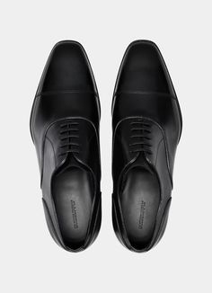 Black Oxford in Italian Calf Leather | SUITSUPPLY US Black Almond Toe Leather Shoes For Business, Black Almond Toe Oxfords For Business, Elegant Brogue Leather Shoes For Business, Elegant Leather Brogue Shoes For Business, Elegant Goodyear Welted Calf Leather Shoes, Black Leather Shoes With Leather Sole For Business, Timeless Formal Wingtip Leather Shoes, Black Plain Toe Leather Shoes For Formal Occasions, Black Plain Toe Formal Leather Shoes