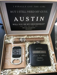 an open box containing two personal flasks and a bottle opener