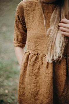 This loose fit linen dress not only looks great for everyday wear, but is so comfy too! Made from soft washed organic linen it feels extremely smooth and pleasant on the skin. For easy and comfortable wear we've made the neckline large enough to fit in. * Loose and relaxed dress can fit all types of figures * Hidden pockets on the side seams * Handmade from 100% natural washed and soft medium weight OEKO-TEX certified linen * Washed and soft medium weight linen (160g) * Linen is long lasting. Po Loose Linen Dress, Fall Linen Dress, Nothing Fits But Dress, Fall Linen Outfits, Modest Linen Dress, Brown Embroidered Cotton Dresses, Brown Relaxed Fit Cotton Dress, Spring Tunic Dress With Yoke Detail, Linen Summer Dresses