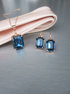 "This elegant Montana Sapphire jewelry set is made with fine emerald cut Premium Quality European Crystal and is available in gold, silver or rose gold finish. The set features drop earrings and a delicate necklace with the matching pendant.  - The earrings measure 7/8\" long and 3/8\" wide - The chain necklace measures 18\" long and the pendant is 1\" tall * RETURN POLICY - We do not accept returns for a refund as all of out items     are made to order. But please contact us if you are     havi Formal Sapphire-colored Emerald-cut Jewelry, Elegant Octagon Sapphire Jewelry, Rectangular Rose Gold Jewelry For Party, Elegant Blue Emerald-cut Jewelry, Formal Sapphire Jewelry With Square Cut, Square Cut Sapphire Jewelry For Formal Occasions, Formal Rose Gold Sapphire Jewelry, Gold Octagon Sapphire Jewelry, Blue Faceted Jewelry For Formal Occasions