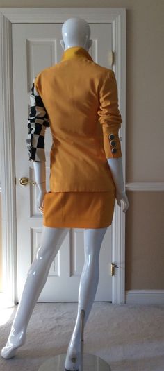 "This vintage Moschino skirt is in his iconic taxi cab/school bus yellow. Fully lined in yellow rayon. Side zipper with self button. Front and back shaping seams. Measurements - Waist - 27' Hips - 36\" Length - 18\"" Fall Fitted Mini Skirt Suit, Fall Fitted Mini Length Skirt Suit, Fall Mini Length Fitted Skirt Suit, Retro Fitted Yellow Mini Skirt, Retro Yellow Fitted Mini Skirt, Fitted Retro Yellow Mini Skirt, Retro Fitted Mini Skirt For Fall, Chic Yellow Mini Skirt For Work, Yellow Mini Skirt