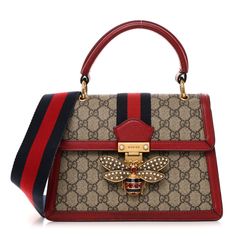 This is an authentic GUCCI GG Supreme Monogram Small Queen Margaret Top Handle Bag in Red. This stylish shoulder bag is crafted of Gucci GG supreme monogram coated canvas, with red calfskin leather trim. The bag features a rolled leather top handle, an optional red and navy web stripe shoulder strap, and an aged gold jewel and pearl-encrusted bee motif on the crossover flap. The bag opens with a press-lock to a partitioned beige microfiber interior with zipper and patch pockets. Gucci Shoulder Bag With Branded Hardware In Coated Canvas, Gucci Coated Canvas Shoulder Bag With Branded Hardware, Red Monogram Canvas Shoulder Bag For Travel, Designer Burgundy Shoulder Bag With Branded Hardware, Red Monogram Canvas Bag With Dust Bag, Gucci Monogram Canvas Shoulder Bag With Branded Hardware, Gucci Bag With Gold-tone Hardware In Signature Coated Canvas, Gucci Red Shoulder Bag For Everyday Use, Red Coated Canvas Bag With Detachable Handle