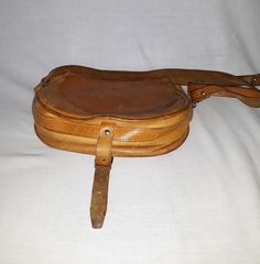 "Vintage camel brown leather crossbody bag. Boho adventure bag. Casual shoulder purse/pouch. Rustic hippie flap bag. European retro 70s purse. Without lining. The bag has frontal compartment with the rivet. condition: normal vintage. On the purse surface are many scratches. Inside are spots, look at the photo No.7 and No.8, please. measurements: height 21 cm / 8.2\" in width 26 cm / 10.1\" in strap in longest position length 146 cm / 57\" in" 70s Purse, Adventure Bags, Italian Bags, Brown Leather Crossbody Bag, Crossbody Bag Women, Leather Bag Women, How To Make Handbags, Retro 70s, Purse Pouch