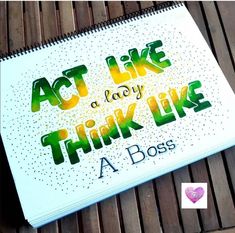 a notebook with the words act like a lady think like a boss written on it