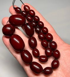 54 Antique Faturan Cherry Bakelite Beads Necklace Marbled. Very quality beads,rare shape. 27 total beads with small holes and veins. Biggest size bead 27.70 mm x 19.35 mm. Smaller size bead 11.40 mm x 9.30 mm. For any question feel free to ask. Large Round Beads For Jewelry Making, Oval Large Beads For Jewelry Making, Oval Beads For Jewelry Making, Large Oval Beads For Jewelry Making, Amber Oval Beaded Necklaces For Jewelry Making, Amber Oval Beads Necklace For Jewelry Making, Amber Beaded Necklaces With Large Round Beads, Amber Beaded Necklaces With Large Oval Beads, Amber Beaded Necklace With Large Oval Beads