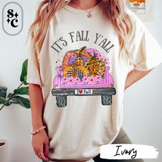 Embrace the cozy vibes of autumn with our adorable "IT'S FALL Y'ALL" shirt! Featuring a cute pink pickup truck loaded with a variety of pumpkins painted in leopard patterns, checkered designs, polka dots, sparkles, and flowers, this shirt is the perfect blend of fun and festive. Whether you're headed to a pumpkin patch or just enjoying the season, this It's Fall Y'all Shirt is a must-have for your wardrobe. Made from soft Comfort Colors fabric, this Tshirt will keep you feeling great all day long. Celebrate the season in style with this charming pumpkin patch t-shirt. The vibrant design and playful text make it an excellent choice for any fall event, from Halloween parties to casual outings. Show off your love for autumn and all things pumpkin with this cute Halloween tee. If fall is your Pumpkin Spice Tshirt, Babe Shirt, Checker Design, Fall Tee, Hello Fall, Halloween Tees, Leopard Pattern, It's Fall, Cozy Fashion