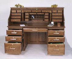 a wooden desk with drawers underneath it