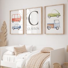 a child's bedroom with three framed pictures on the wall, including a bed and toys