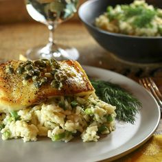 a white plate topped with fish and rice