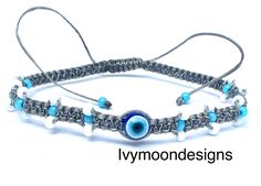 Handmade beaded bracelet-Evil eye bracelet-Handmade jewellery  Adjustable, unisex, waterproof bracelet  Grey, white and blue colours    -waxed cotton thread-1mm    -Miyuki Japanese glass seed beads-2mm    -acrylic bead -evil eye-6mm The bracelet is easily adjusted to fit any size wrist using the sliding knot . The wax coating protects the colour and makes the bracelet incredibly strong and durable. LENGTH : all bracelets are fully adjustable. They are made to measure approximately 16/17cm when c Adjustable Evil Eye Bracelets For Meditation, Adjustable Spiritual Evil Eye Bracelet For Meditation, Spiritual White Friendship Bracelets For Festival, Handmade Spiritual Evil Eye Bracelet For Meditation, White Spiritual Hand-strung Friendship Bracelets, Spiritual Adjustable Evil Eye Beaded Bracelets, Adjustable Spiritual Evil Eye Beaded Bracelets, Adjustable Spiritual Beaded Bracelet With Evil Eye, Handmade Adjustable Spiritual Evil Eye Bracelet