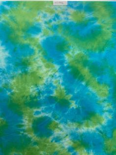 a blue and green tie - dyed background that looks like something out of the sky