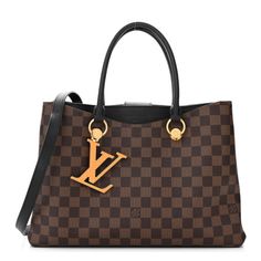 This is an authentic LOUIS VUITTON Damier Ebene LV Riverside in Black. This tote is crafted of signature damier toile brown check canvas. This shoulder bag features rolled black leather top handles with gold round anchors, an orange LV charm, and front patch pocket. The top opens to a partitioned black microfiber interior with a central zipper compartment and a patch pocket. Black Louis Vuitton, Louis Vuitton Neverfull Monogram, Monogram Neverfull, Black Leather Top, Louis Vuitton Totes, Louis Vuitton Damier Azur, Louis Vuitton Shoulder Bag, Louis Vuitton Damier Ebene, Damier Ebene