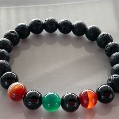 Gorgeous Multicolored Natural Agate Stones Mixed With Black Lava Stones Can Be Used As Essential Oil Diffuser Bracelet By Adding One Or Two Drops Of Your Favorite Essential Oil To The Lava Beads For Aromatherapy This Is A Bracelet That Could Be Unisex And Go With Your Entire Wardrobe Size Is 6.25” Easy Slip On Style Strong And Durable Stretchy Bracelet New Handmade In My Atlanta Jewelry Studio Be Sure To Check Size Before Purchasing Let Me Know If You Have Any Questions Ready To Ship Bundle Item Black Agate Jewelry For Healing, Black Agate Healing Jewelry, Black Agate Round Bead Jewelry, Black Agate Round Beads Jewelry, Casual Black Beaded Bracelets With Natural Stones, Black Agate Beaded Bracelets With Natural Stones, Black Agate Bracelets For Healing, Black Agate Beaded Bracelet With Natural Stones, Adjustable Black Gemstone Bracelet