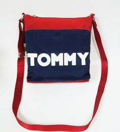 100% AUTHENTIC NEW TOMMY HILFIGER RED+BLUE NYLON,DOUBLE SILVER ZIPPER,LOGO CROSSBODY,BAG BRAND NEW with TAGS! Very Stylish!  Approximate measurements: CROSS BODY STRAP 16" MIN and 23" MAX DROP EXTERIOR: This beautiful bag is made of nylon RED nylon cross body strap  Polished silver tone hardware Top zipper closure One large zip pocket on the front Interior:  Red nylon interior One zipper pocket on the back wall Red Tommy Hilfiger name plate on the back wall WE LIST DIFFERENT STYLES OF ITEMS EVER Colorful Tote Bags, News Letter, Silver Zipper, Bag Brand, Beautiful Bags, Red Blue, Cross Body, Zipper Pocket, Bags Handbags