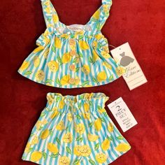 New With $40 Tags Is An Adorable Striped Lemon Drop Pattern 2-Piece Short Set By Well Known Classic Children's Clothier Rare Editions! Size 2t Made Of 95% Polyester And 5% Spandex - Very Soft Fabric! Striped Pattern With Lemon Drops And Lemon Slices - Super Cute! Colors - Blue/Green/Yellow & White Pullover Top That Has A 4 Buttons On The Front & Knotted Attached Bows On The Shoulder Straps Neckline Is Ruffled Sleeve Area Is Ruffled Elastic Smocking On The Top - One Row Just Under The Ruffle - St Yellow Sets For Playtime In Summer, Yellow Sets For Summer Playtime, Yellow Summer Playtime Sets, Yellow Playtime Sets For Summer, Cute Yellow Sets For Summer, Fun Yellow Summer Sets, Casual Play Sets For Spring, Cute Yellow Summer Sets, Cute Yellow Summer Set