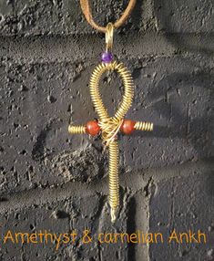 Beautiful amethyst & carnelian Ankh necklace. Handmade Ankh Spiritual Jewelry, Spiritual Ankh Jewelry For Jewelry Making, Spiritual Wire Wrapped Cross Pendant Necklace, Handmade Ankh Symbolic Necklace, Handmade Cross Jewelry For Meditation, Spiritual Necklaces With Natural Stones In Cross Shape, Spiritual Cross Necklace With Natural Stones, Ankh Necklace, Spiral Ring