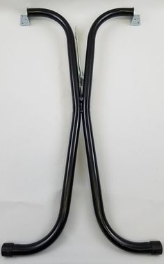 two black hoses connected to each other on a white surface