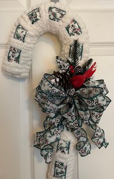 a christmas wreath hanging on the front door