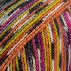 multicolored skeins of yarn are shown in this close up shot photo