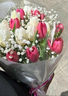 a bouquet of tulips and baby's breath