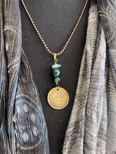 This french coin is from 1951 with an image of a rooster.  Paired with moss agate and dyed green Quartz beads.  20 inch chain.  Ships in a gift box. Not exactly what you're looking for? Check out my other coin necklaces http://etsy.me/1NTyIXH Browse my pieces on sale >> http://etsy.me/1HSJXNR Beaded Coin Necklace, French Rooster, French Coins, Quartz Beads, Green Quartz, Unique Gemstones, Coin Necklace, Moss Agate, Gemstone Necklace