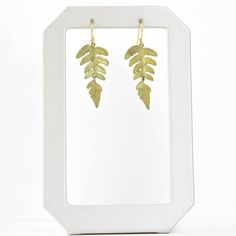 Handmade in the USA Bronze with soft green patina Gold filled french ear wires Earrings measure 1.5" long ABOUT SILVER SEASONS Silver Seasons Jewelry collection is brought to you by designer Michael Michaud. Known for his nature-inspired metal work, Michaud casts his pieces from real plant life and other natural specimens. Designs include everything from statement leaf necklaces to realistic flower earrings, bangle bracelets, drop earrings, and pendants. ABOUT GOLDMAKERS Goldmakers Jewelry creates and curates a comprehensive selection of artfully designed hand-crafted jewelry. We aspire to offer the jewelry enthusiast access to affordable classics as well as fresh innovative designs. Green Brass Earrings Nature-inspired, Leaf-shaped Brass Earrings With Ear Wire, Nature-inspired Hand Forged Gold Earrings, Gold Nature-inspired Hand Forged Earrings, Hand Forged Green Earrings For Gift, Nature-inspired Drop Earrings With Lever Back Ear Wires, Botanical Leaf-shaped Earrings With Ear Wire, Michael Michaud, Ring Icon