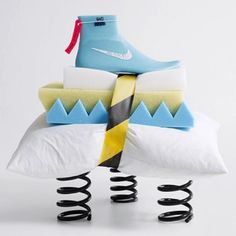 a pair of shoes sitting on top of pillows