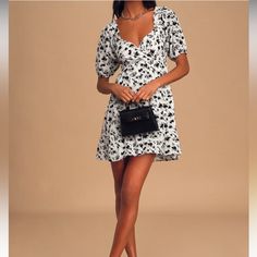 Never Worn Black And White Mini Dress. The Dress Is Low Cut But Fits True To Size. Link To The Lulu Site Below To See Reviews. Https://Www.Lulus.Com/Products/Can-T-Hurry-Love-White-Floral-Puff-Sleeve-Mini-Dress/1065982.Html?Utm_source=Sendgrid_tr&Utm_medium=Email&Utm_campaign=Order_confirmation Floral Print Puff Sleeve Mini Dress For Date Night, White Fitted Puff Sleeve Dress With Floral Print, Chic Puff Sleeve Dress With Floral Print For Vacation, Chic Puff Sleeve Floral Dress For Vacation, Chic Floral Puff Sleeve Dress For Vacation, Cute Floral Print Mini Dress For Date Night, Fitted V-neck Puff Sleeve Dress For Vacation, White Floral Print Puff Sleeve Dress, Feminine Printed Mini Dress With V-neck