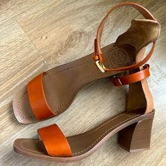 Rum Colored Strap Low Heeled Sandals With A Wrap Strap On Ankles. Very Elegant And Pretty. Overall, In Excellent Condition. Comes From A Smoke And Pet Free Home. Please Don’t Hesitate To Ask Any Questions Like The Item But Not The Price? Feel Free To Send Me An Offer Luxury Sandals With Wooden Heel And Ankle Strap, Luxury Brown Sandals With Stacked Heel, Orange Leather Sandals With Low Heel, Orange Leather Low Heel Sandals, Cognac Open Toe Sandals For Summer, Orange Low Heel Leather Sandals, Chic Orange Sandals With Buckle Closure, Luxury Tan Heels For Summer, Elegant Orange Sandals With Block Heel