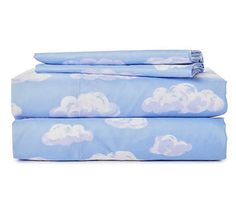 two blue sheets with clouds on them are folded in front of each other, and one is