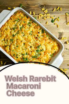 a casserole dish with cheese and parsley in it on a wooden table