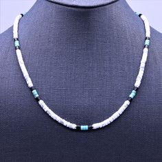 "This Native American inspired beaded heishi necklace is made with natural white buffalo turquoise from Nevada, blue green turquoise, black onyx, and sterling silver spacer beads. The beads are uniform in size, making for a clean flowing pattern of semi precious gemstones. The AAA grade white buffalo turquoise beads are beautiful shades of gray and white polished to a fine quality semi gloss luster that compliments that of the green turquoise and black onyx. White Buffalo Turquoise This rare whi White Heishi Beads Hand-strung Necklaces, White Heishi Beads Necklaces Hand-strung, White Hand-strung Heishi Bead Necklaces, White Heishi Beads Artisan Jewelry, Hand-strung White Heishi Bead Necklaces, White Artisan Heishi Bead Jewelry, Artisan White Gemstone Beads Necklaces, Artisan White Necklaces With Gemstone Beads, Artisan White Single Strand Beads