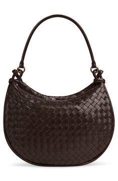 With this soft leather shoulder bag, crafted in the house's iconic intrecciato weave, a removable exterior pouch captures all the things you want close at hand. Top zip closure Shoulder strap Removable exterior zip pouch; interior zip pocket Lined Leather Made in Italy Designer Handbags Intrecciato Weave Crossbody Bag For Office, Office Intrecciato Weave Crossbody Bag, Formal Satchel Bag With Intrecciato Weave, Elegant Woven Leather Hobo Bag For Travel, Classic Woven Leather Shoulder Bag For Shopping, Classic Woven Leather Tote Shoulder Bag, Brown Intrecciato Weave Office Bag, Intrecciato Weave Crossbody Shoulder Bag For Office, Intrecciato Weave Satchel Shoulder Bag For Office