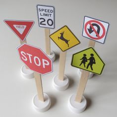 a group of traffic signs sitting on top of each other next to a sign that says, printable traffic signs for kids i doodles