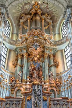 an ornately decorated organ in a church