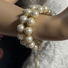 Add a touch of timeless elegance to your jewellery collection with this stunning White Shell Pearls bracelet with 2 layers of 12mm pearls and luxurious gold rhinestones. Each glossy bead is crafted to mimic the radiant beauty of real pearls, creating a sophisticated and versatile piece. They are luxurious, heavy and cold, just like the real ones. Materials: 12mm Shell Pearls, gold rhinestones, gold plated stainless steel clasp Shell pearls are made from crushed shells. Oyster shells are cut and transformed into powder and then reformed into perfect pearl shape with an infinite shine.  They are very popular as a natural alternative to expensive pearls.  Available lengths:  5.5inches/14cm 6inches/15.2cm  6.5inches/16.5cm 7inches/17.8cm  7.5inches/19cm 8inches/20.2cm  8.5inches/21.6cm CUSTOM Elegant Double Strand Gold Beaded Bracelet, Formal Pearl White Beaded Bracelets With Pearl Chain, Elegant Gold Double Strand Beaded Bracelet, Pearl White Bracelets With Pearl Drop For Party, Pearl White Bracelet With Pearl Drop For Party, Elegant Beaded Bracelets With Pearl Charm For Party, Elegant Double Strand Gold Pearl Bracelet, White Pearl Embellished Bracelets For Party, Elegant Gold Double Strand Pearl Bracelet