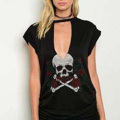 Short Sleeve Tee Is Black With White Skull And Cross Bones And Also Has Red Roses With Green Leaves. Back Is Blank. 86% Polyester 10% Rayon And 4% Spandex. Ruching Along Bottom Of Both Side Seams. Hand Wash Recommended. Casual Tops With Skull Shape For Alternative Fashion, Punk Black V-neck Top, Punk Style Black V-neck Top, Black V-neck Punk Top, Edgy Tops For Alternative Fashion In Spring, Trendy Skull Tops For Halloween, Trendy Skull Shaped Tops For Halloween, Trendy Skull Shaped Tops For Fall, Casual Skull Print Top For Alternative Fashion