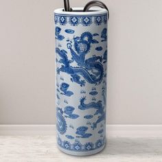 Cylindrical umbrella stand in traditional Chinese blue and antiqued white porcelain colors. Classic dragons design with floral and traditional detail. Made of strong vitreous porcelain. Great waterproof storage for umbrellas, canes, and walking sticks. Alternatively use as a floor vase for dry plant or lucky bamboo displays. Color: Blue & White. Dragons Design, Dragon Blue, Canes And Walking Sticks, White Noise Machine, Italian Landscape, Lucky Bamboo, Chinese Blue, Red Lantern, Dry Plants