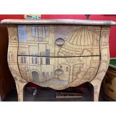 a wooden cabinet with an artistic design painted on it