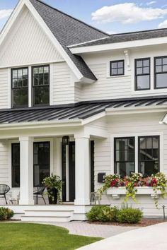 a white house with black trim and windows