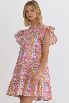 Dive into the colors of spring with our vibrant Watercolor Floral Ruffle Sleeve Dress. Perfect for any sunny day outing, this dress features a lively floral pattern in a spectrum of pinks, yellows, and blues set against a soft peach background. The playful hues are reminiscent of a painter's brush strokes, making it a walking piece of art. Perfect for a gender reveal, baby shower, and more. SIZE & FIT Fit is true to size Model is 5'9" wearing size small FABRIC & CARE 100% Cotton Self 100% Polyester Lining Hand wash cold Line dry DETAILS Lightweight and breathable fabric ideal for warm weather, ensuring comfort without sacrificing style. This charming dress boasts a tiered structure that adds volume and movement. Each tier is separated by delicate lace trims that enhance its feminine appeal Black Date Night Outfit, Peach Background, Nashville Style, Vibrant Watercolor, Ruffle Sleeve Dress, Bride Accessories, Lace Trims, Playsuit Romper, Summer Knitting