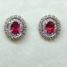 Product code: 105000 weight: 3.450 grams gemstone name: ruby gemstone weight: 2.05 cts diamond wt: 0.85 ct closure: pushback dimensions: 15.00mm x 13.00mm Classic Ruby Diamond Earrings With Diamond Accents, Classic Ruby Diamond Earrings With Accents, Classic Red Diamond Earrings With Accents, Red Oval Diamond Earrings For Anniversary, Oval Red Diamond Earrings For Anniversary, Red Diamond Hallmarked Earrings, Red Ruby Round Diamond Earrings, Red Gemstone Diamond Earrings, Diamond Stud Earrings