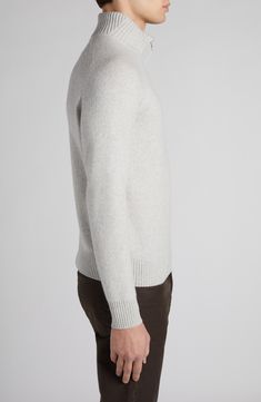 This cozy pullover sweater is knit with a chunky rib collar and streamlined raglan sleeves from an ultrasoft blend of lambswool and cashmere. Subtle leather details accent the zipper and puller. 26 1/2" length (size 50EU) Half-zip closure Stand collar Long sleeves Ribbed cuffs and hem 67% wool, 33% cashmere with leather trim Dry clean Made in Italy Designer Clothing Winter Lambswool Sweater With Ribbed Cuffs, Winter Cashmere Sweater With Ribbed Neckline, Winter Cashmere V-neck Sweater With Ribbed Cuffs, Winter Wool Sweater With Ribbed Neckline, Winter Merino Wool V-neck Sweater With Ribbed Cuffs, Cozy Cashmere Sweater With Ribbed Collar, Cozy Wool Polo Sweater With Ribbed Cuffs, Half Zip Sweater, Cozy Pullover