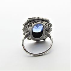 "Victorian marcasite, art glass cabochon and sterling silver statement ring, perhaps originally a mourning ring! This ring appears to be from the latter part of the 1800's and per the gemologist was typically worn with those high collared long black dresses of the period that one sees in old photos and many times as a mourning ring (also known as a memory ring). It is a large piece with the crown measuring approximately 25 mm by 19 mm. and rising a comfortable 7.5 mm from the finger to the very Antique Oval Moonstone Ring Collectible, Victorian Silver Engraved Ring For Formal Occasions, Victorian Engraved Rings For Memorial, Victorian Engraved Memorial Rings, Vintage Oval Cabochon Sapphire Ring For Formal Occasions, Antique Cabochon Sapphire Ring For Formal Events, Antique Cabochon Sapphire Ring, Antique Oval Hallmarked Moonstone Ring, Vintage Opal Cabochon Ring For Collectors