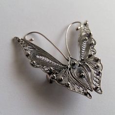 "Butterfly Brooch Mariposa Filigrana - Sterling Silver Brooch - Filigree Jewelry - Butterfly Jewelry - Filigree Brooch - Gift Idea for Her Mariposa means Butterfly in Spanish. Filigree - delicate jewellery technique made from silver or golden threads \"embroidering\" kind of metalwork lace that is specific to Spain, especially an Andalusian town Cordoba, where they call it a cordobese filigree. This craftsmanship has been passed from generation to generation, nonetheless nowadays there are very Victorian Wedding Brooches With Intricate Design, Elegant Silver Butterfly Brooches, Elegant Silver Butterfly Brooch, Butterfly Filigree Jewelry For Weddings, Butterfly Filigree Wedding Jewelry, Wedding Butterfly Filigree Jewelry, Traditional Formal Brooch With Intricate Design, Ornate Wedding Brooch With Intricate Design, Ornate Wedding Brooches With Intricate Design