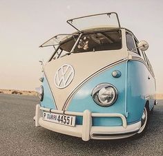 an old vw bus is parked on the road