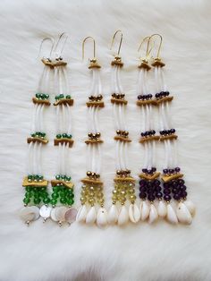 Made with 1" dentalium shells, deer hide, cowrie shells and mother of pearl shells with glasss rondelle beads on kidney hooks. Measures 7" from kidney hook to the end of shells. Deer Hide, Cowrie Shells, Cowrie Shell, Pearl Shell, Chandelier Earrings, Mother Of Pearl, Favorite Jewelry, Glass Beads, Shells