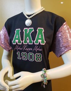 **This Item is in high demand, due to the hand sewing that is required to complete this order it will take between 2-3 weeks to ship. Thanks! This re-designed Sequin Sleeve Tee has Glitter Bling Double Applique Greek Letters and Year. This tee will have you Sparkling all over the place. This tee will be also be available for Zetas, Deltas and SGRho members. This tee will not disappoint, you will love the shine from the front of the sleeves. Please allow 5 to 10 business days to ship due to tees